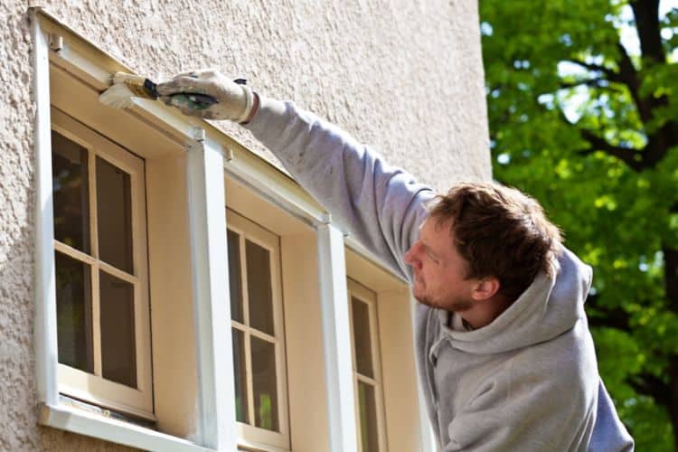 House Painter Working on External Window Repaint