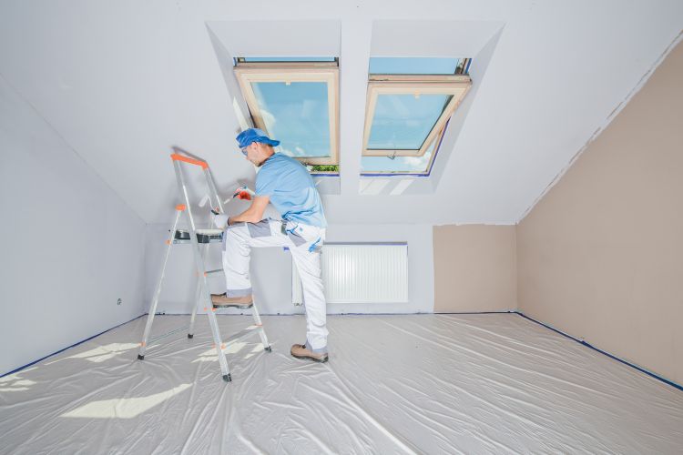 Man Repainting Home Interior in White