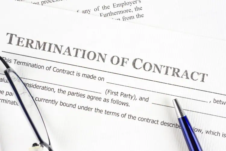 Termination of Contract Documents With a Pen and Glasses on Top of It